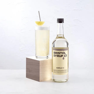 Bristol Syrup Co bottle with a cocktail on a white background