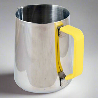 Stainless steel frothing jug with a yellow handle on a gray background